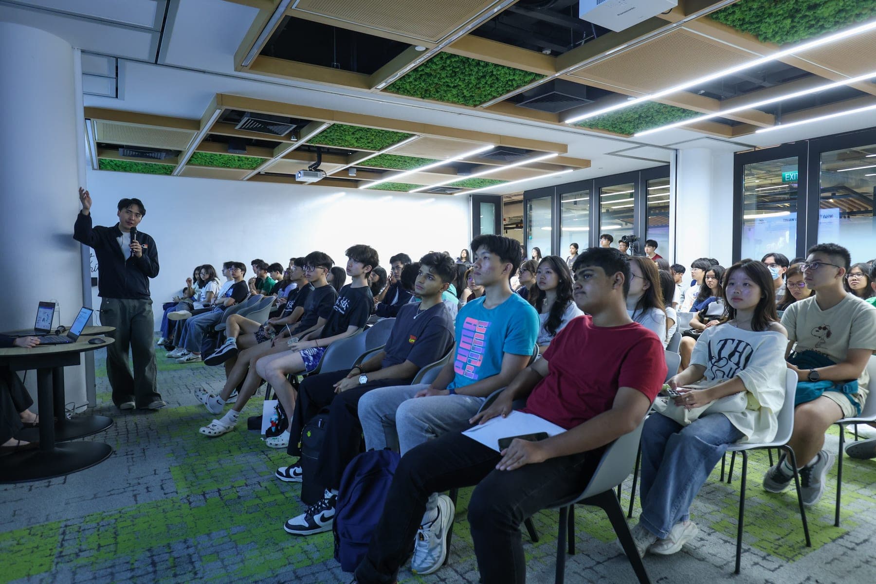 An audience listening at a past MACRO talk